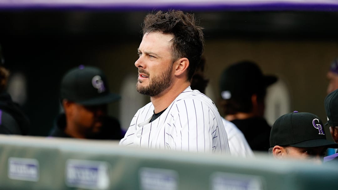 Apr 9, 2025; Denver, Colorado, USA; Colorado Rockies designated hitter Kris Bryant (23) looks on from the dugout before the game against the Milwaukee Brewers at Coors Field. 