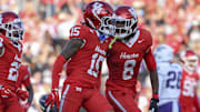 Nov 22, 2025; Houston, Texas, USA; Houston Cougars defensive back Will James (15) celebrates with defensive back Kentrell Webb (8) after an interception during the second quarter against the TCU Horned Frogs at TDECU Stadium. Mandatory Credit: Troy Taormina-Imagn Images