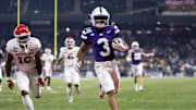 Dec 26, 2024; Phoenix, AZ, USA; Kansas State Wildcats running back Dylan Edwards (3) runs for a touchdown against the Rutgers Scarlet Knights during the second half of the Rate Bowl at Chase Field. Mandatory Credit: Mark J. Rebilas-Imagn Images