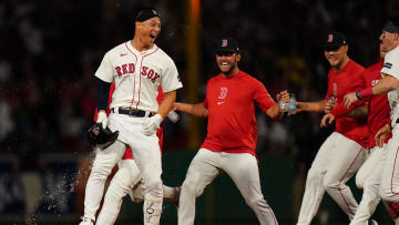 Aug 12, 2024; Boston, Massachusetts, USA; Boston Red Sox left fielder Rob Refsnyder (30) singles to center field to drive in the winning run against the Texas Rangers in the tenth inning at Fenway Park. Mandatory Credit: David Butler II-USA TODAY Sports