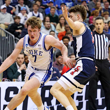 Mar 27, 2025; Newark, NJ, USA; Duke Blue Devils guard Kon Knueppel (7) shoots the ball against Arizona Wildcats guard Anthony Dell'Orso (3) during the first half during an East Regional semifinal of the 2025 NCAA tournament at Prudential Center. Mandatory Credit: Vincent Carchietta-Imagn Images