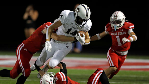 Wisconsin high school football: Appleton North's Grant Hardy dives versus Hortonville in a Fox Valley Association game.