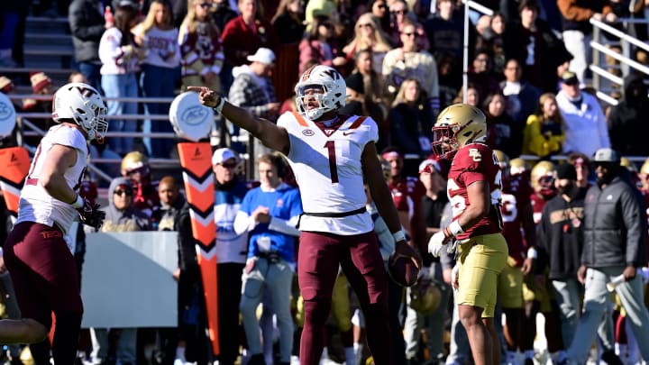 Nov 11, 2023; Chestnut Hill, Massachusetts, USA; Virginia Tech Hokies quarterback Kyron Drones (1) reacts to running for a first down against the Boston College Eagles during the first half at Alumni Stadium. Mandatory Credit: Eric Canha-USA TODAY Sports