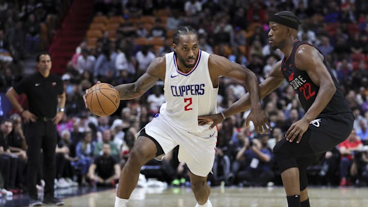 Feb 4, 2024; Miami, Florida, USA; LA Clippers forward Kawhi Leonard (2) drives to the basket against Miami Heat forward Jimmy Butler (22) during the fourth quarter at Kaseya Center. Mandatory Credit: Sam Navarro-Imagn Images