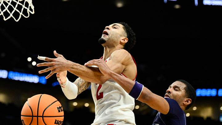 Mar 19, 2026; Portland, OR, USA; High Point Panthers guard Rob Martin (3) knocks the ball away from Wisconsin Badgers guard Nick Boyd (2) during the second half of a first round game of the men's 2026 NCAA Tournament at Moda Center. Mandatory Credit: Troy Wayrynen-Imagn Images