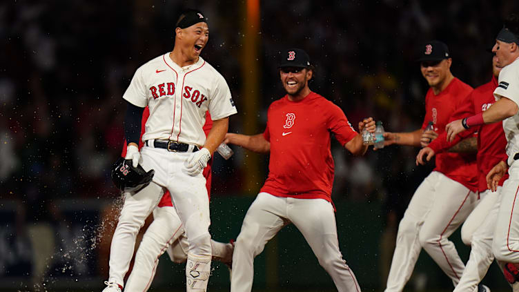 Aug 12, 2024; Boston, Massachusetts, USA; Boston Red Sox left fielder Rob Refsnyder (30) singles to center field to drive in the winning run against the Texas Rangers in the tenth inning at Fenway Park. Mandatory Credit: David Butler II-USA TODAY Sports