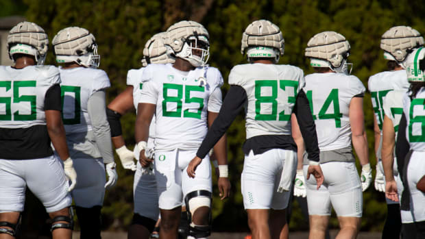 Oregon players work out during practice with the Ducks Tuesday, April 23, 2024 at the Hatfield-Dowlin Complex in Eugene, Ore.