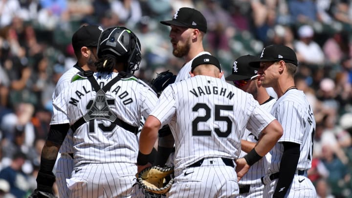 Apr 13, 2024; Chicago, Illinois, USA; Chicago White Sox starting pitcher Garrett Crochet (center) meets with teammates at the mound during the second inning against the Cincinnati Reds at Guaranteed Rate Field. Mandatory Credit: Patrick Gorski-USA TODAY Sports