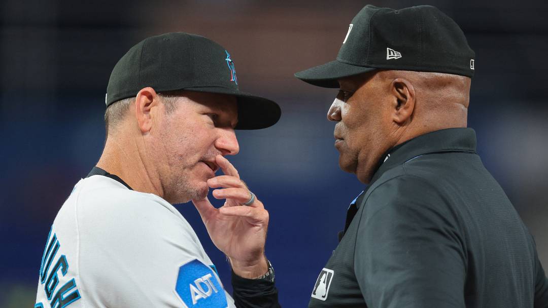 Miami Marlins manager Clayton McCullough and umpire Laz Diaz. Miami Marlins manager Clayton McCullough and umpire Laz Diaz.