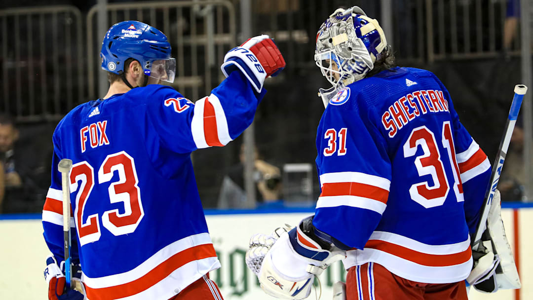 Mar 4, 2022; New York, New York, USA; New York Rangers defenseman Adam Fox (23) and goaltender Igor Shesterkin (31) celebrate a 3-1 win against the New Jersey Devils at Madison Square Garden. Mandatory Credit: Danny Wild-Imagn Images