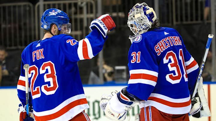 Mar 4, 2022; New York, New York, USA; New York Rangers defenseman Adam Fox (23) and goaltender Igor Shesterkin (31) celebrate a 3-1 win against the New Jersey Devils at Madison Square Garden. Mandatory Credit: Danny Wild-Imagn Images
