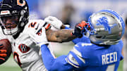 Chicago Bears wide receiver DJ Moore (2) carries the ball defended by Detroit Lions cornerback D.J. Reed (4) 