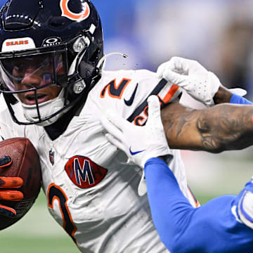Chicago Bears wide receiver DJ Moore (2) carries the ball defended by Detroit Lions cornerback D.J. Reed (4) 