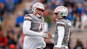 UNLV Rebels quarterback Jayden Maiava (1) celebrates his touchdown pass with offensive lineman Tiger Shanks (70) in the first quarter against the Air Force Falcons at Falcon Stadium. 