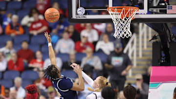 Mar 7, 2025; Greensboro, NC, USA;  Georgia Tech Yellow Jackets guard Tonie Morgan (5) shoots the ball against NC State Wolfpack during the third quarter at First Horizon Coliseum. Mandatory Credit: Cory Knowlton-Imagn Images