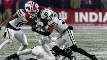 Nothing but the hits: Dillon Thieneman drives a shoulder into Indiana wide receiver Ke'Shawn Williams during a game in November. In two years patrolling the Boilermaker secondary, Thieneman accounted for 210 tackles and six interceptions. Mandatory Credit: Trevor Ruszkowski-Imagn Images