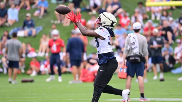 New England Patriots running back Rhamondre Stevenson (38) makes a catch during training camp at Gillette Stadium.