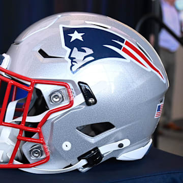 Jan 17, 2024; Foxborough, MA, USA; A New England Patriots helmet sits on a table prior to a press conference at Gillette Stadium. Mandatory Credit: Eric Canha-Imagn Images