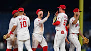 Angels second baseman Luis Rengifo (2), third baseman Oswald Peraza (10), shortstop Zach Neto (9) and first baseman Logan Davidson (21) celebrate the victory against the Minnesota Twins at Angel Stadium on Sept. 9.