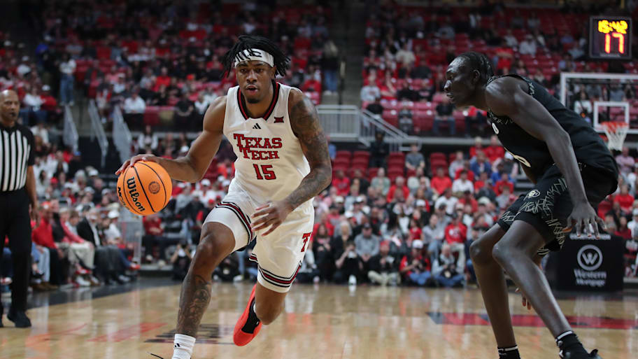 Texas Tech forward JT Toppin works the ball against Colorado forward Bangot Dak.