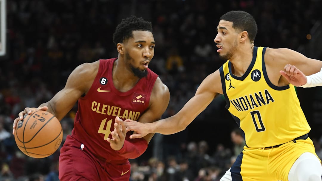 Dec 16, 2022; Cleveland, Ohio, USA; Indiana Pacers guard Tyrese Haliburton (0) defends against Cleveland Cavaliers guard Donovan Mitchell (45) during the second half at Rocket Mortgage FieldHouse. Mandatory Credit: Ken Blaze-Imagn Images