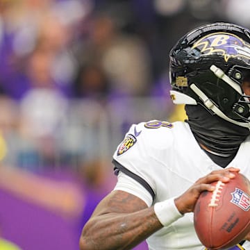 Nov 9, 2025; Minneapolis, Minnesota, USA; Baltimore Ravens quarterback Lamar Jackson (8) passes against the Minnesota Vikings in the first quarter at U.S. Bank Stadium. Mandatory Credit: Brad Rempel-Imagn Images