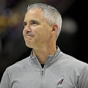 Mar 9, 2024; Tallahassee, Florida, USA; Florida State Seminoles head football coach Mike Norvell accepts the Bear Bryant coach of the Year award during a media timeout of a basketball game against the Miami Hurricanes at Donald L. Tucker Center. Mandatory Credit: Melina Myers-Imagn Images
