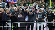 Feb 9, 2025; New Orleans, LA, USA; Philadelphia Eagles owner Jeffrey Lurie hoists the Vince Lombardi Trophy after defeating the Kansas City Chiefs in Super Bowl LIX at Ceasars Superdome. 