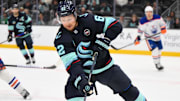 Mar 27, 2025; Seattle, Washington, USA; Seattle Kraken defenseman Brandon Montour (62) plays the puck during the third period against the Edmonton Oilers at Climate Pledge Arena. Mandatory Credit: Steven Bisig-Imagn Images
