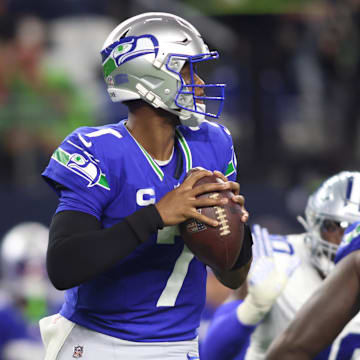 Nov 30, 2023; Arlington, Texas, USA; Seattle Seahawks quarterback Geno Smith (7) looks to pass against the Dallas Cowboys during the first half at AT&T Stadium. Mandatory Credit: Tim Heitman-Imagn Images