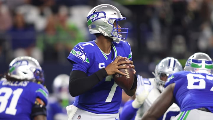 Nov 30, 2023; Arlington, Texas, USA; Seattle Seahawks quarterback Geno Smith (7) looks to pass against the Dallas Cowboys during the first half at AT&T Stadium. Mandatory Credit: Tim Heitman-Imagn Images