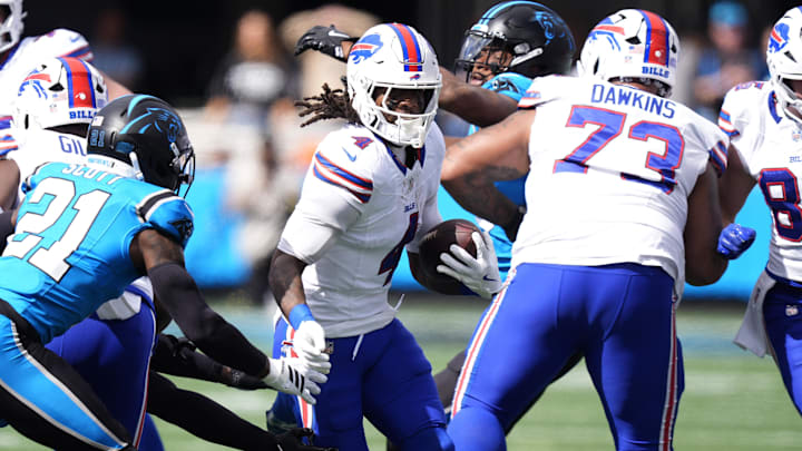 Buffalo Bills running back James Cook III and Carolina Panthers safety Nick Scott.