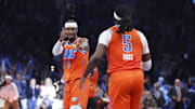 Nov 28, 2025; Oklahoma City, Oklahoma, USA; Oklahoma City Thunder guard Shai Gilgeous-Alexander (2) gestures towards guard Luguentz Dort (5) after a basket against the Phoenix Suns during the second half at Paycom Center. Mandatory Credit: Alonzo Adams-Imagn Images