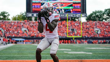 Ohio State Buckeyes wide receiver Jeremiah Smith (4) catches a touchdown pass during the second half of the NCAA football game against the Illinois Fighting Illini at Gies Memorial Stadium in Champaign on Oct. 11, 2025. Ohio State won 34-16.