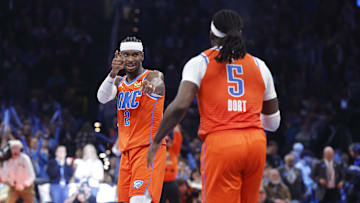 Nov 28, 2025; Oklahoma City, Oklahoma, USA; Oklahoma City Thunder guard Shai Gilgeous-Alexander (2) gestures towards guard Luguentz Dort (5) after a basket against the Phoenix Suns during the second half at Paycom Center. Mandatory Credit: Alonzo Adams-Imagn Images