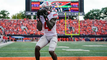 Ohio State Buckeyes wide receiver Jeremiah Smith (4) catches a touchdown pass during the second half of the NCAA football game against the Illinois Fighting Illini at Gies Memorial Stadium in Champaign on Oct. 11, 2025. Ohio State won 34-16.