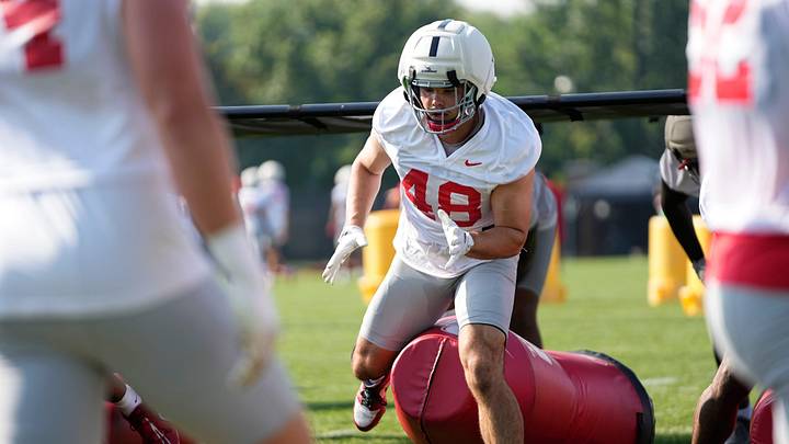 Ohio State Buckeyes defensive lineman Logan George (48) hits a tackling dummy during football training camp at the Woody Hayes Athletic Center on Aug. 1, 2025.