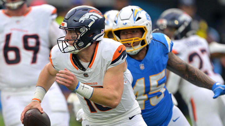 Broncos quarterback Bo Nix, left, is pressured by Chargers linebacker Tuli Tuipulotu. Broncos quarterback Bo Nix, left, is pressured by Chargers linebacker Tuli Tuipulotu.