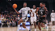 Dec 3, 2025; Atlanta, Georgia, USA; Georgia Tech Yellow Jackets forward Kowacie Reeves Jr. (14) drives past Mississippi State Bulldogs guard Shawn Jones Jr. (5) in the second half at McCamish Pavilion. Mandatory Credit: Brett Davis-Imagn Images
