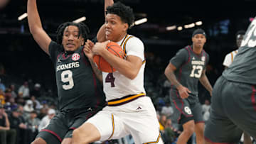ASU Sun Devils guard Bryce Ford (4) drives past Oklahoma Sooners guard Nijel Pack (9) at Mortgage Matchup Center on Dec. 6, 2025, in Phoenix, Arizona.
