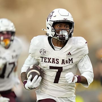 Nov 8, 2025; Columbia, Missouri, USA; Texas A&M Aggies wide receiver KC Concepcion (7) runs for a touchdown during the second half against the Missouri Tigers at Faurot Field at Memorial Stadium. Mandatory Credit: Jay Biggerstaff-Imagn Images