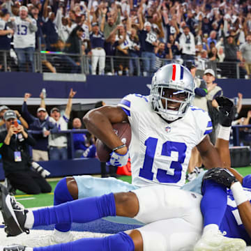 Nov 12, 2023; Arlington, Texas, USA;  Dallas Cowboys wide receiver Michael Gallup (13) makes a touchdown  catch past New York Giants cornerback Tre Hawkins III (37) during the second half at AT&T Stadium. Mandatory Credit: Kevin Jairaj-Imagn Images