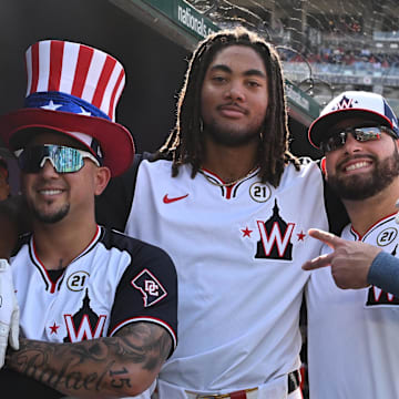 Sep 15, 2024; Washington, District of Columbia, USA; Washington Nationals left fielder James Wood (center) celebrates his second home run of the game by posing with second baseman Ildemaro Vargas (left) and first baseman Juan Yepez (right) by posing for a photo against the Miami Marlins during the eighth inning at Nationals Park.