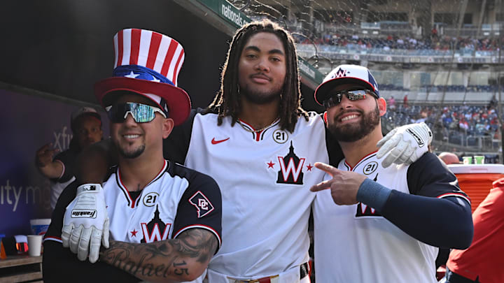 Sep 15, 2024; Washington, District of Columbia, USA; Washington Nationals left fielder James Wood (center) celebrates his second home run of the game by posing with second baseman Ildemaro Vargas (left) and first baseman Juan Yepez (right) by posing for a photo against the Miami Marlins during the eighth inning at Nationals Park.