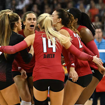 Dec 17, 2022; Omaha, Nebraska, US;  The Louisville Cardinals celebrate a point against the Texas Longhorns at CHI Health Center. Mandatory Credit: Steven Branscombe-Imagn Images