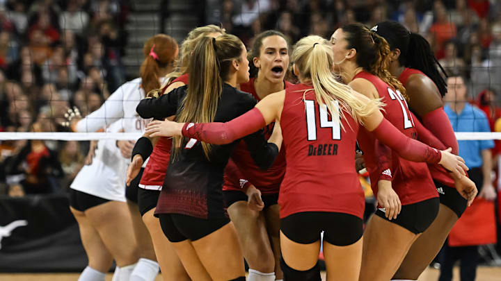 Dec 17, 2022; Omaha, Nebraska, US;  The Louisville Cardinals celebrate a point against the Texas Longhorns at CHI Health Center. Mandatory Credit: Steven Branscombe-Imagn Images