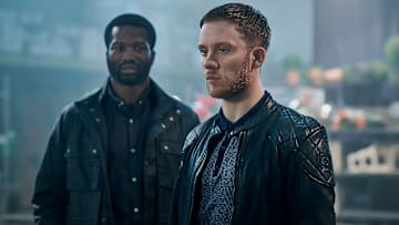 L to R: Ṣọpẹ Dìrísù as Elliot Finch and Joe Cole as Sean Wallace in Gangs of London. Photo Credit: AMC/SKY