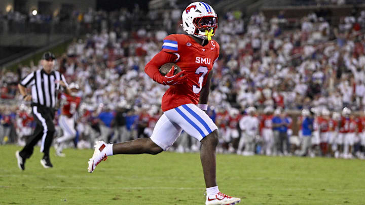 Aug 30, 2025; Dallas, Texas, USA; Southern Methodist Mustangs safety Ahmaad Moses (3) returns an interception for a touchdown against the East Texas A&M Lions during the second half at Gerald J. Ford Stadium. Mandatory Credit: Jerome Miron-Imagn Images