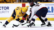 Oct 26, 2024; Nashville, Tennessee, USA; Nashville Predators center Colton Sissons (10) wins a face-off against Columbus Blue Jackets center Adam Fantilli (19) in the third period at Bridgestone Arena. Mandatory Credit: Casey Gower-Imagn Images