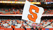Sep 15, 2018; Syracuse, NY, USA; A Syracuse Orange cheerleader and mascot Otto perform on the field prior to the game against the Florida State Seminoles at the Carrier Dome. 